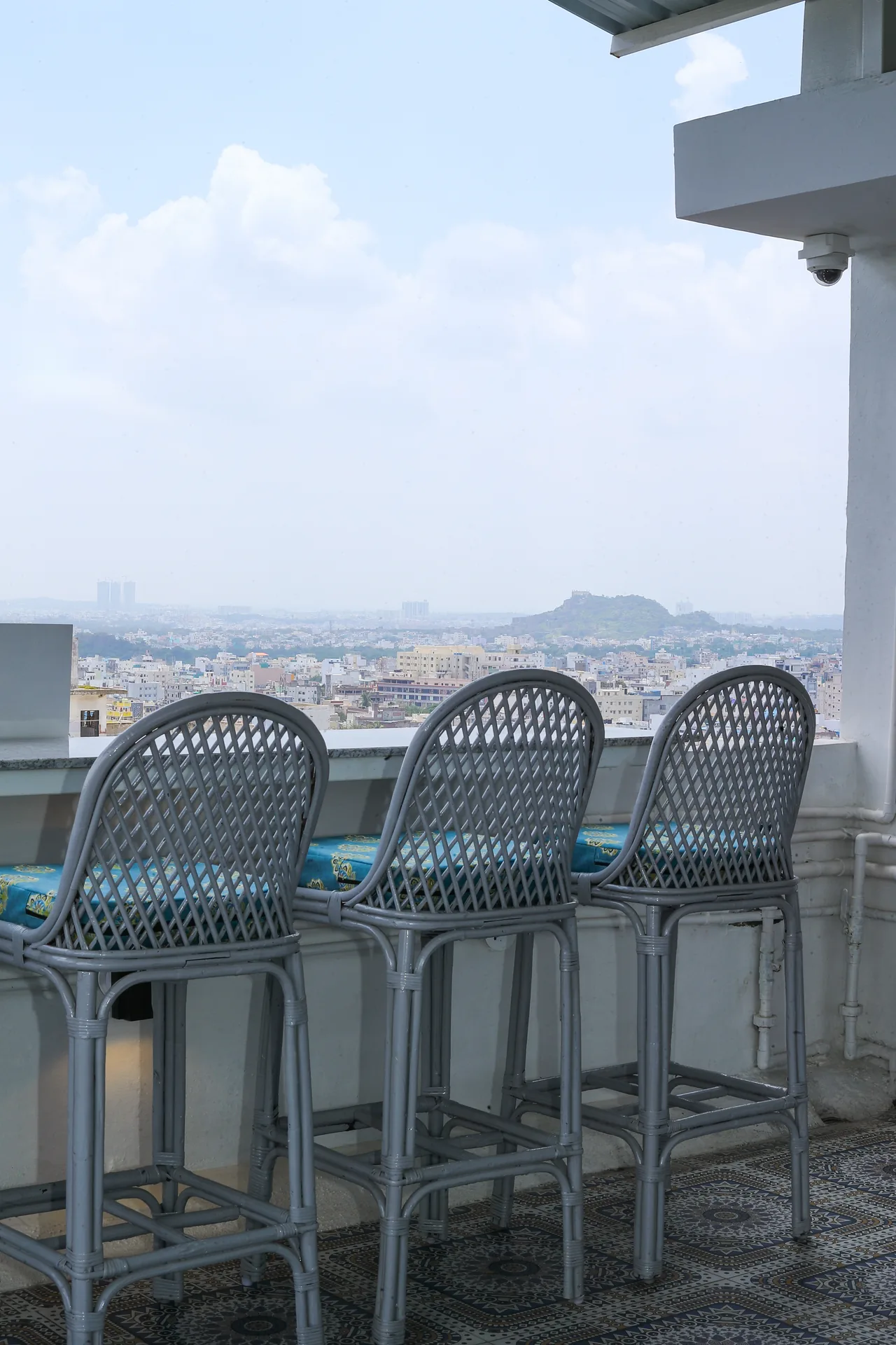 The rooftop counter seating with an open view of the sky and city