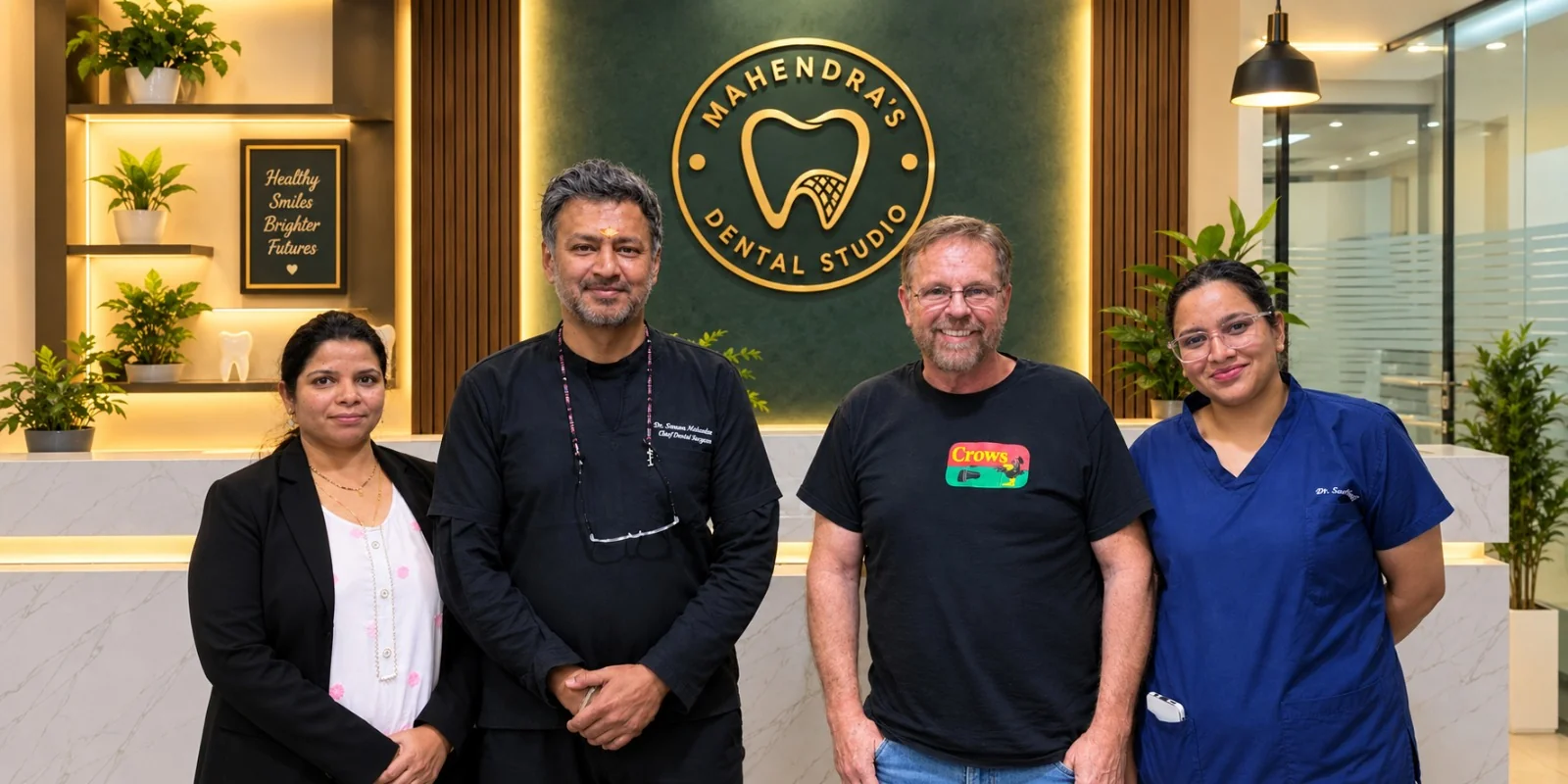 An international dental patient with the Mahendra's Dental Studio team at the clinic reception in Banjara Hills, Hyderabad
